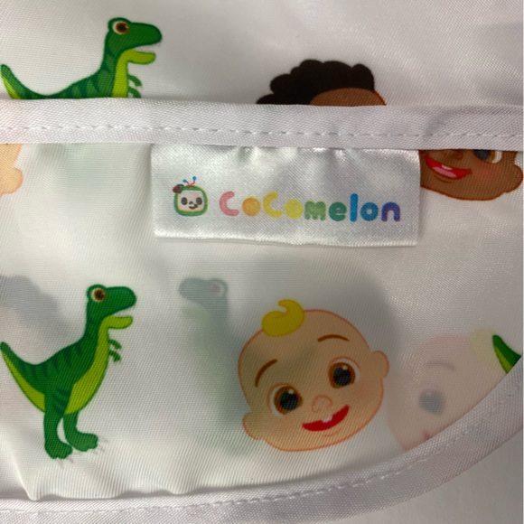 CoComelon pocket feeding bib white with dinosaurs and faces - Picture 3 of 6